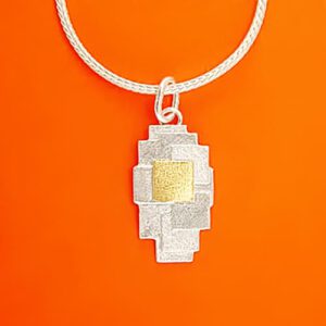 Pendant with a patchwork pattern
